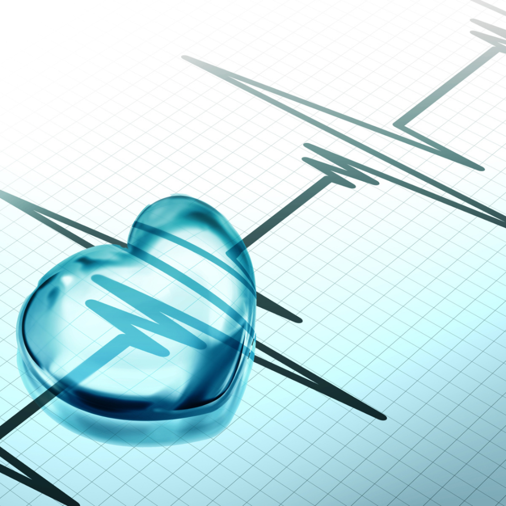 This image features a stylized heart shape made of blue glass, overlaying an electrocardiogram (ECG) line on a grid background.